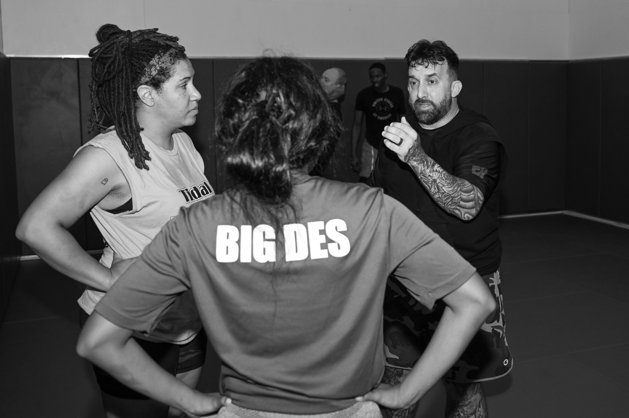 photo of instructor instructing two participants.