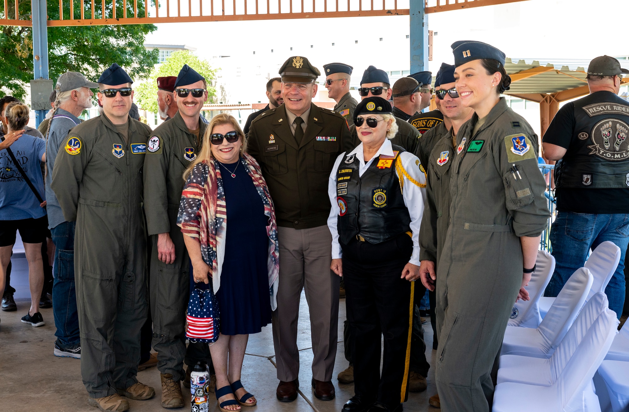 A group of people pose for a group photo.