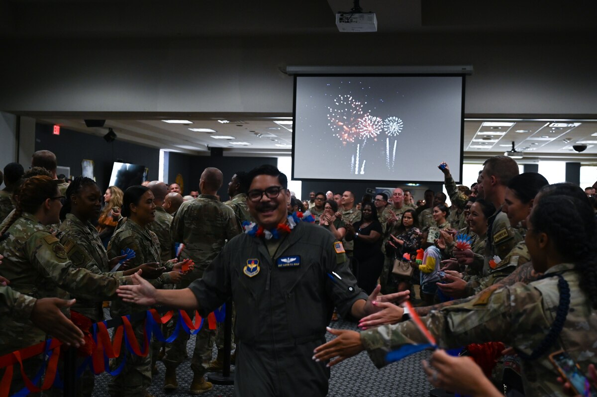 U.S. Air Force Staff Sgt. Alister Guale, 316th Training Squadron, walks to receive his certificate during a Tech. Sgt. Release Party at the Powell Event Center, Goodfellow Air Force Base, Texas, July 3, 2024. Tech. Sgts. operate as technical experts, serving as supervisors and ensuring proper and effective use of all resources under their control. (U.S. Air Force photo by Airman 1st Class Brian Lummus)