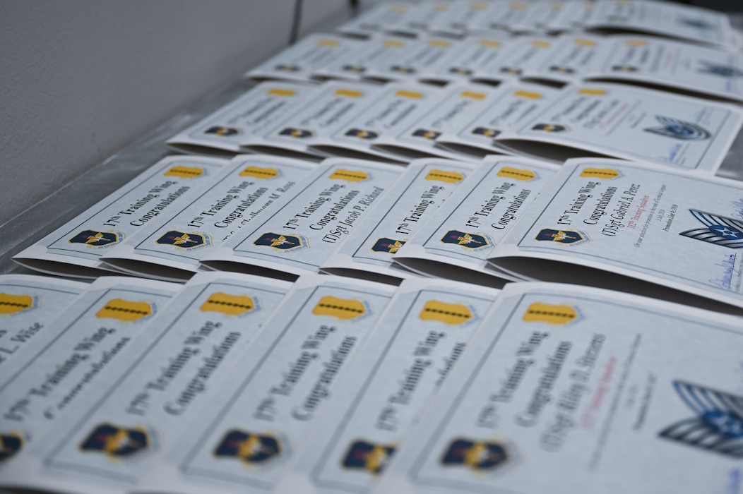 Promotion certificates lay on a table during a Tech. Sgt. Release Party at the Powell Event Center, Goodfellow Air Force Base, Texas, July 3, 2024. Goodfellow congratulated 35 members for achieving the next milestone in their careers and preparing to assume the responsibilities of Tech. Sgts. (U.S. Air Force photo by Airman 1st Class Brian Lummus)