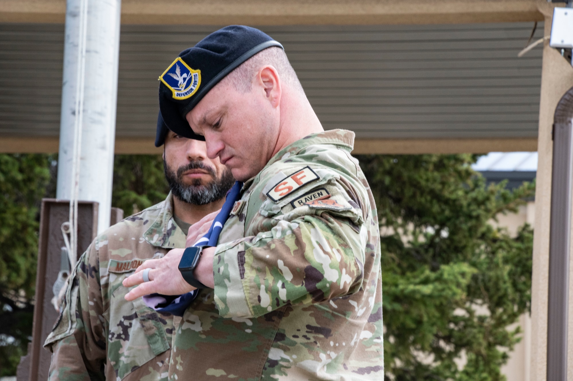 Master Sgt. Joshua Marugg, 268th Security Forces, folds the American flag during the Final Roll ceremony held at Clear Space Force Station, Alaska, during Police Week.