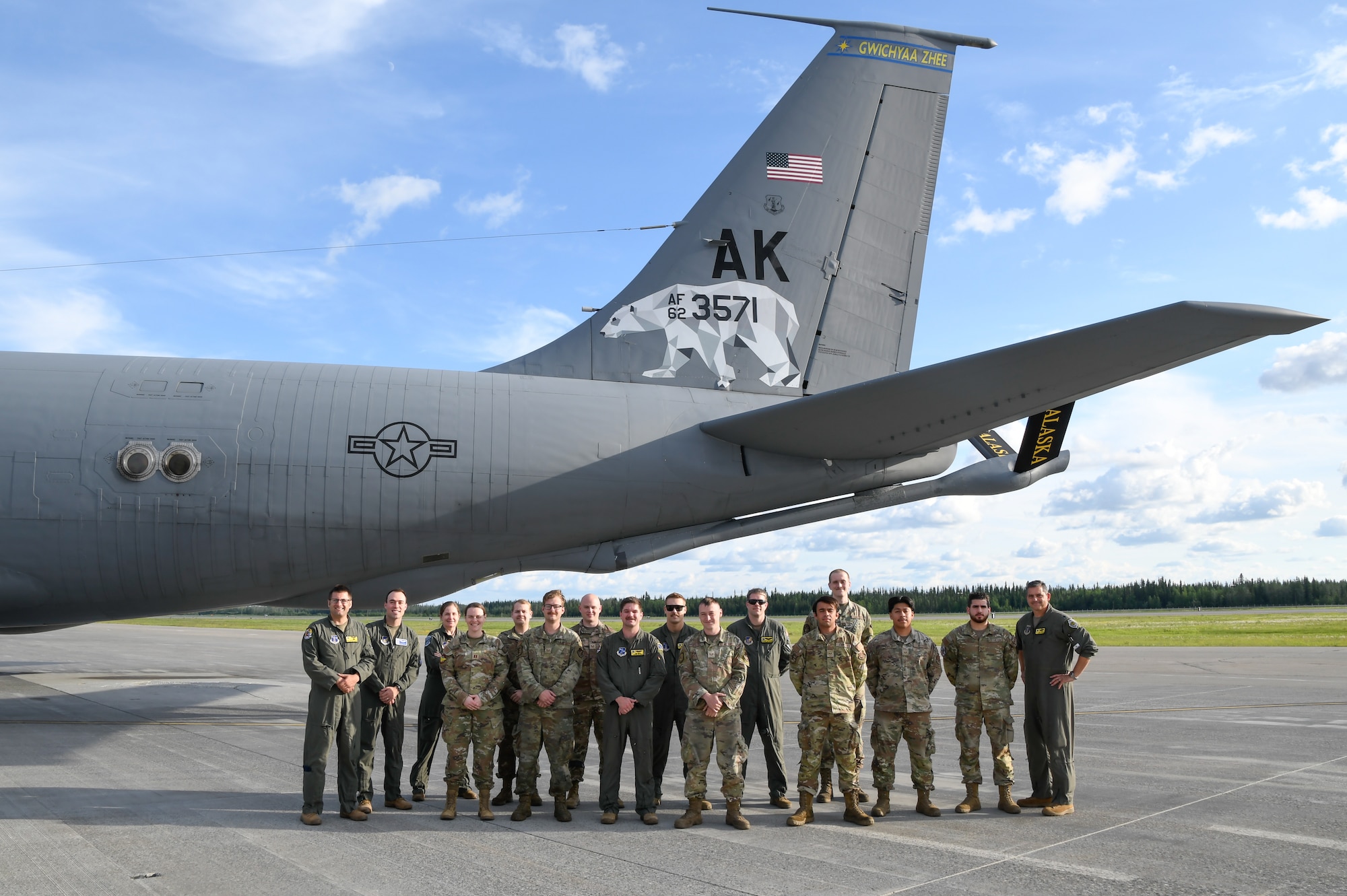 The 168th Wing KC-135 pilots and boom operators take a photo with the 25th and 51st Fighter Squadron Maintenance Airmen, 355th and 25th Fighter Squadron Flight docs, and 354th Fighter Wing physical therapist, who received an incentive flight on board the 168th Wing KC-135 Stratotanker.