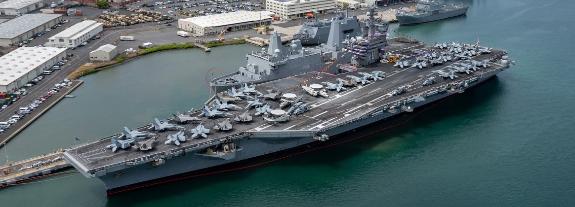 An aerial view of Nimitz-class aircraft carrier USS Carl Vinson (CVN 70), moored at Joint Base Pearl Harbor-Hickam during Rim of the Pacific 2024.