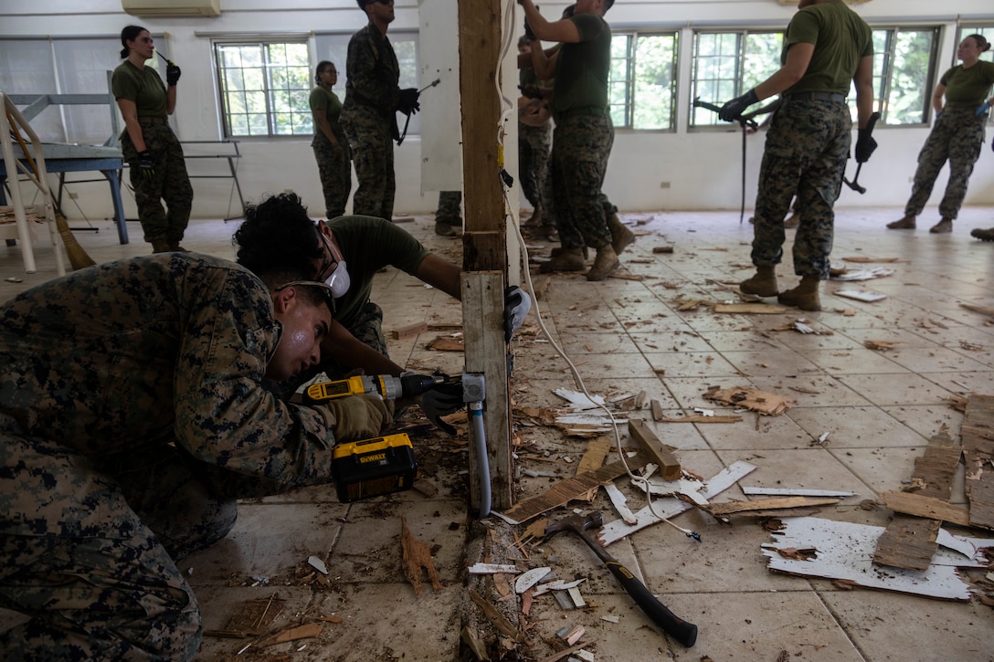 U.S. Marines with Combat Logistics Battalion 13, Combat Logistics Regiment 17, 1st Marine Logistics Group, execute the deconstruction phase of the Peleliu Civic Center restoration project on Peleliu, Republic of Palau, July 1, 2024, an effort to commemorate the 80th anniversary of the Battle of Peleliu. During Koa Moana’s deployment throughout the Indo-Pacific region, U.S. Marines and Sailors from I Marine Expeditionary Force, work to strengthen alliances and partnerships with development of interoperable capabilities, combined operations, theater security cooperation, and capacity-building efforts. Exercises like Koa Moana administer 1st MLG to tackle complex challenges by fostering collaboration among bold thinkers and employing creative methods to optimize prepositioning, enhance sustainment and distribution networks, and bolster readiness in distributed environments such as Palau, the Federal States of Micronesia, and Papua New Guinea. (U.S. Marine Corps photo by Cpl. Brandon Marrero)