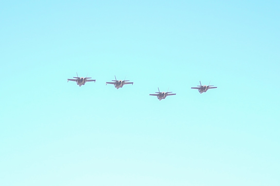 Royal Australian Air Force F-35A Lightning II aircraft assigned to the RAAF No. 75 Squadron conduct a flyover during a bilateral training flight alongside U.S. Marine Corps F-35B Lightning II aircraft assigned to Marine Fighter Attack Squadron (VMFA) 214, Marine Aircraft Group 13, 3rd Marine Aircraft Wing, over RAAF Base Tindal, Northern Territory, Australia, June 20, 2024. Leaders with VMFA-214, a USMC F-35B squadron, flew the RAAF F-35A during bilateral training, exhibiting interchangeability between RAAF and U.S. Marine aviation. VMFA-214 deployed more than 200 Marines and eight F-35B Lightning II aircraft from Marine Corps Air Station Yuma, Arizona, to RAAF Base Tindal, Australia, to conduct bilateral training with the RAAF No. 3 Squadron and No. 75 Squadron. This iteration of bilateral training allowed for complete interchangeability between RAAF and USMC aviation forces when VMFA-214, an F-35B Lightning II squadron, leaders flew RAAF F-35A variant aircraft. (U.S. Marine Corps photo by Cpl. Nicholas Johnson)