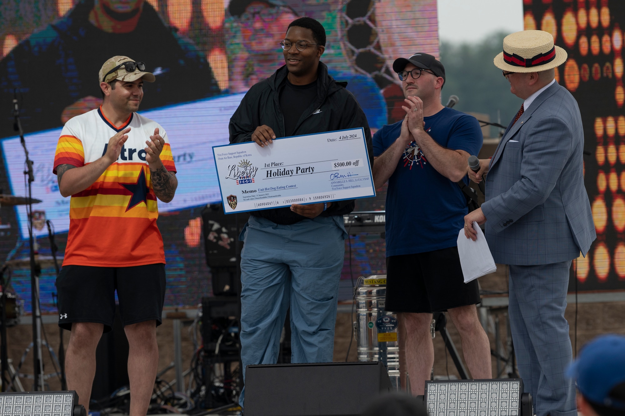 The winning team of the hot dog eating contest receive their prize during Liberty Fest at Osan Air Base, Republic of Korea, July 4, 2024. Independence Day presents an opportunity to reflect on the American ideals of liberty and freedom and how service members defend it. (U.S. Air Force photo by Staff Sgt. Ashley N. Mikaio)