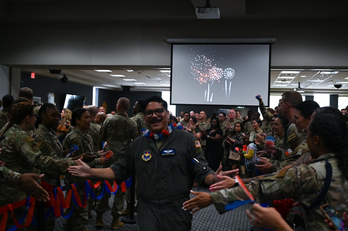 U.S. Air Force Staff Sgt. Alister Guale, 316th Training Squadron, walks to receive his certificate during a Tech. Sgt. Release Party at the Powell Event Center, Goodfellow Air Force Base, Texas, July 3, 2024. Tech. Sgts. operate as technical experts, serving as supervisors and ensuring proper and effective use of all resources under their control. (U.S. Air Force photo by Airman 1st Class Brian Lummus)