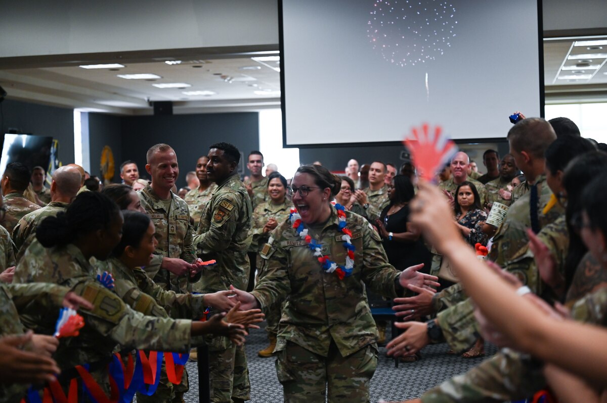 U.S. Air Force Staff Sgt. Amanda Relitz, 17th Healthcare Operations Squadron, walks to receive her certificate during a Tech. Sgt. Release Party at the Powell Event Center, Goodfellow Air Force Base, Texas, July 3, 2024. Goodfellow held the release party to celebrate the Tech. Sgt. selects and to give fellow wingmen and friends an opportunity to congratulate them on their success. (U.S. Air Force photo by Airman 1st Class Brian Lummus)