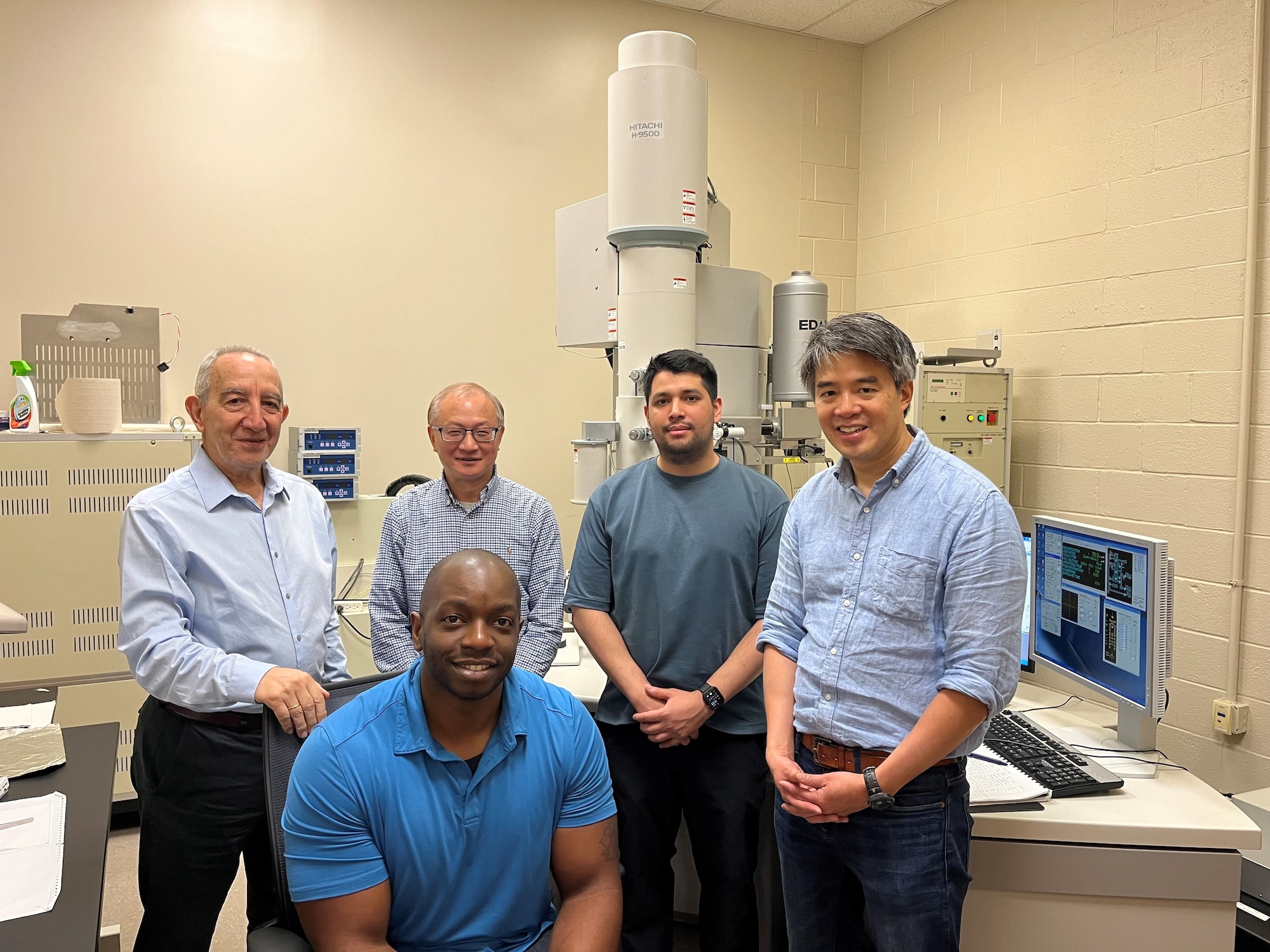 From left: University of Texas in Arlington, or UT Arlington, team members Dr. Stathis Meletis, Dr. Jiechao Jiang, Enrique Ramirez, Dr. Joseph Ngai and Nonso Martin Chetuya gather for a photo at UT Arlington May 16, 2024 to celebrate the successful conclusion to a collaboration with the Air Force Research Laboratory’s Sensors Directorate. The collaboration was made possible through the Minority Leaders Research Collaboration Program and resulted in a significant breakthrough in the development of thin film technology, as a potential lower-cost alternative to be used in infrared light detection. (Courtesy photo / Dr. Yi Shen)