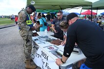 A 36th Security Forces Squadron member observes the Air Force Ball Committee's items.
