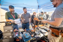 James Clements, instructor, Code 700T, Training, and Samuel Leckron, project test planning engineer, Code 246, Test and Work Control Engineering Division, look at cooling fans June 27, 2024, during a "Pathway to Safety" training event at Puget Sound Naval Shipyard & Intermediate Maintenance Facility in Bremerton, Washington. (U.S Navy photo by Wendy Hallmark)