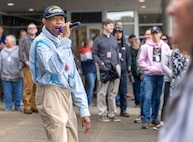 Eric Farmer, Human Resources assistant (Benefits), Commander Pacific Fleet Human Resources Office Northwest, performs as Rapper  E.J Trouble Enuff, for a talent show June 27, 2024, during Puget Sound Naval Shipyard & Intermediate Maintenance Facility's three-day "Pathway To Safety" training event, held June 26-28, in Bremerton, Washington. (U.S Navy Photo by Wendy Hallmark)