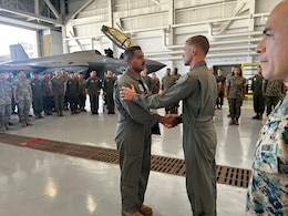 U.S. Marine Corps Gunnery Sgt. Christopher Goad, left, a powerline division chief with Marine Fighter Attack Squadron 314, Marine Aircraft Group 11, 3rd Marine Aircraft Wing, is awarded the Navy and Marine Corps Commendation Medal by Lt. Col. Jeffrey Davis, commanding officer of VMFA-314, at Marine Corps Air Station Miramar, California, July 1, 2024. Goad, president of the VMFA-314 motorcycle riding club, was awarded for providing life-saving aid to a fellow motorcycle rider on April 21, 2024. (U.S. Marine Corps courtesy photo)
