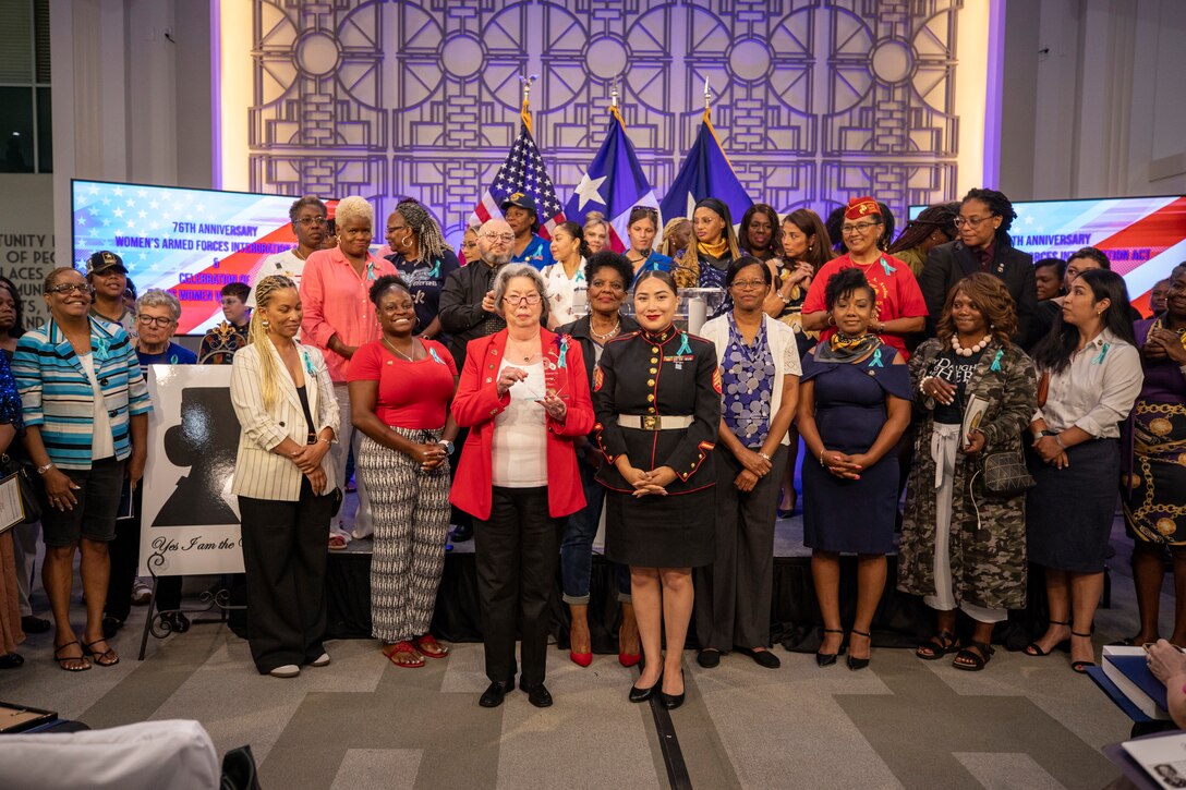 Camilla Thomas, center left, a Marine veteran, and U.S. Marine Corps Sgt. Helen Caro, center right, a recruiter with Recruiting Sub Station Rosenberg, Recruiting Station Houston, pose for a photo with other veterans  during the Texas Women Veteran's Day Ceremony at City Hall, Houston, Texas, June 12, 2024. The ceremony served to honor female veterans and recognize the history of women in the armed services - with the ceremony sharing the same date as the 76th anniversary of the Women's Armed Services Integration Act. Caro is a native of Dallas, Texas. (U.S. Marine Corps photo by Sgt. Ryan H. Pulliam)