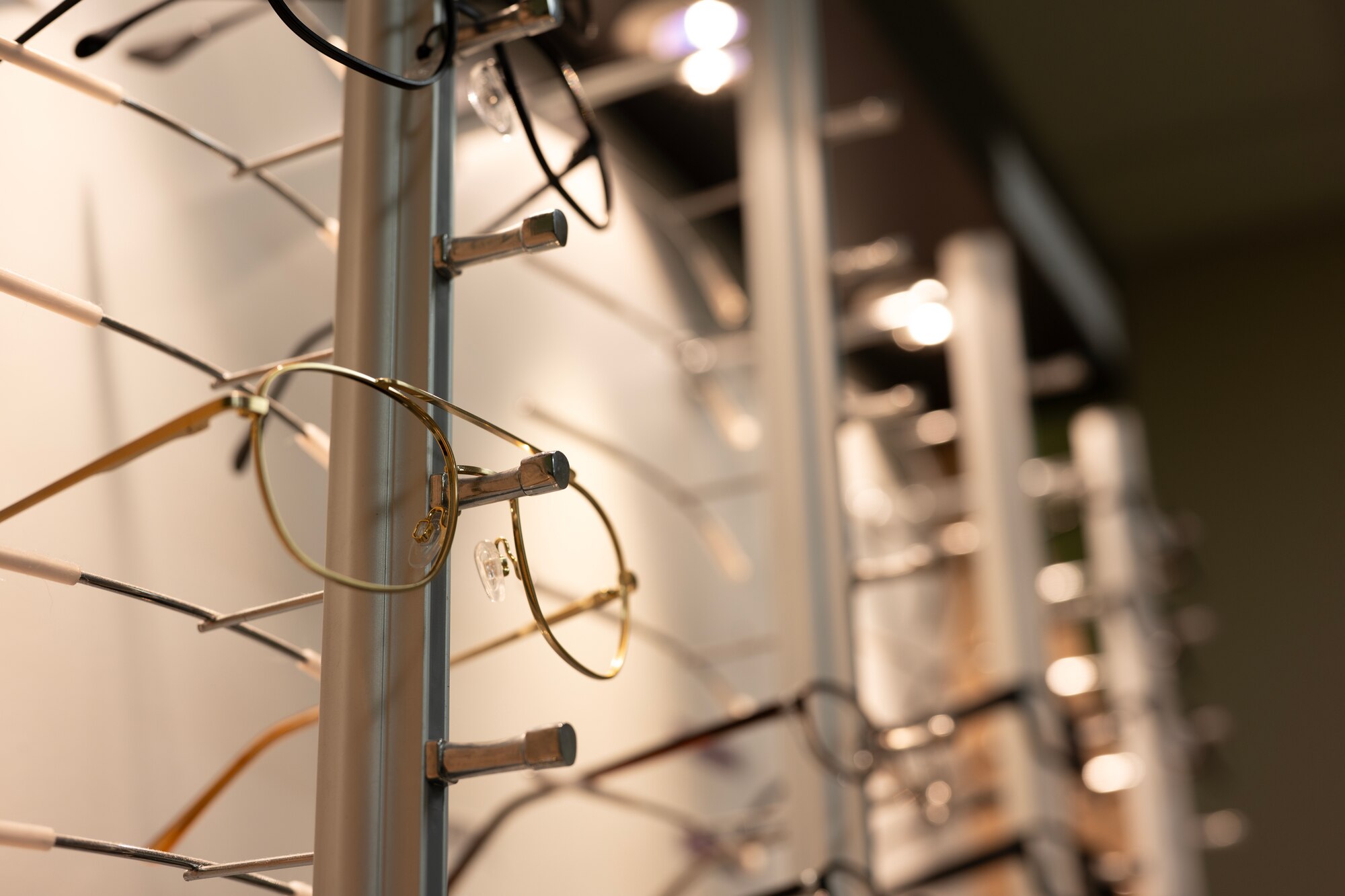 Different styles of glasses line the walls at the Optometry Clinic at Minot Air Force Base, North Dakota, June 28, 2024. Optometry specialists are qualified to diagnose and treat a range of eye conditions in addition to prescribing and fitting lenses that will enhance a patient's vision. (U.S. Air Force photo by Airman 1st Class Alyssa Bankston)