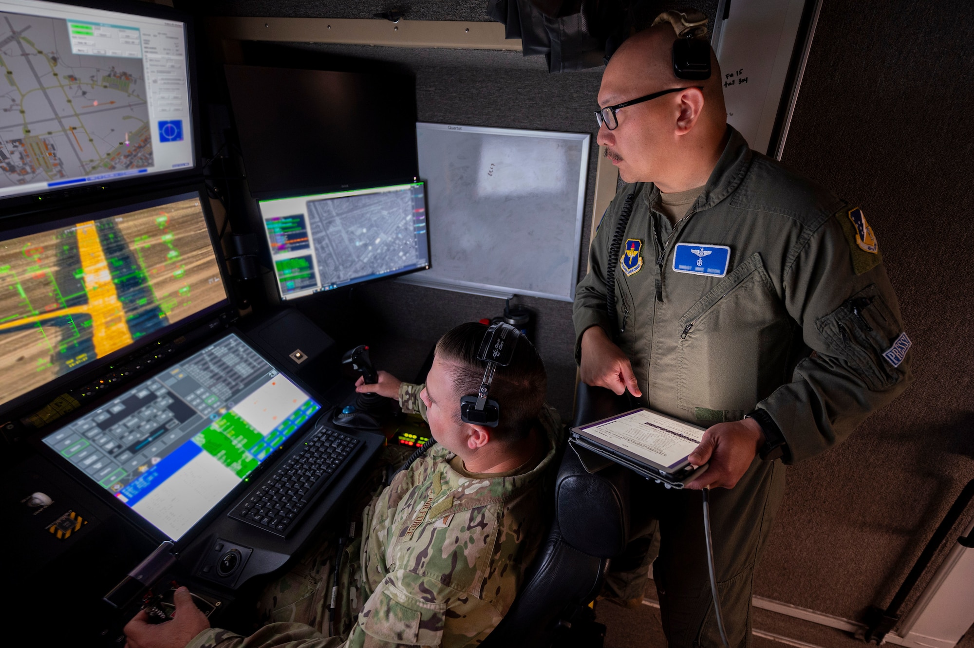 U.S. Air Force Senior Master Sgt. Michael Dizon, 6th Attack Squadron senior enlisted leader, right, oversees MQ-9 Reaper sensor operator training at Holloman Air Force Base, New Mexico, July 8, 2024.
