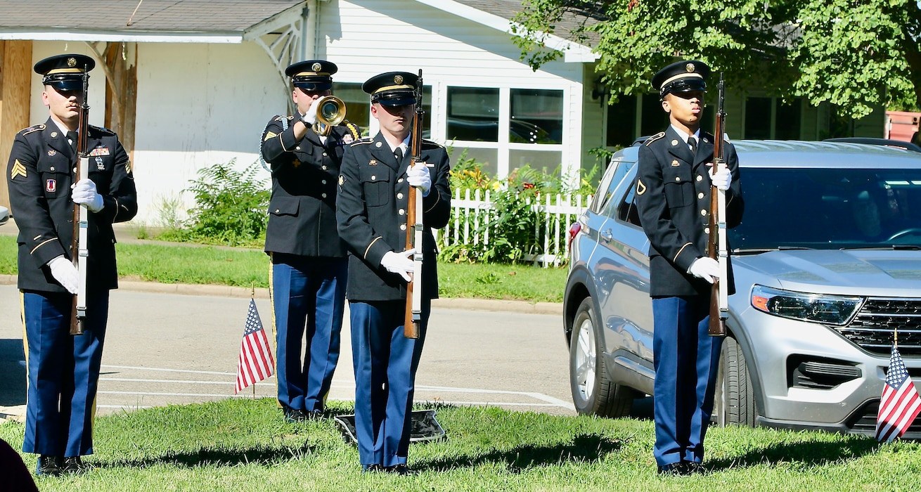 The Illinois Army National Guard Funeral and Honors Team prepares to fire a volley during a dedication ceremony on July 6 as a section of State Highway 133 through Oakland, Illinois, was named the 1st Lt. Jared W. Southworth Highway.