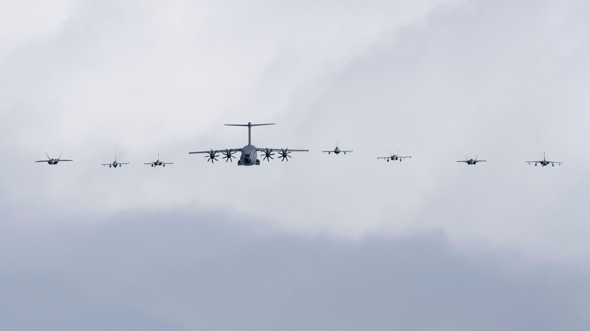 Eight aircraft from America, Germany, Spain and France in a line