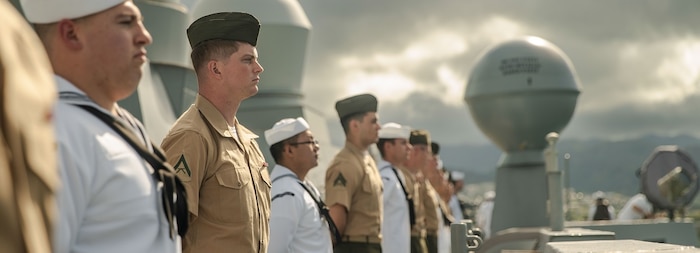 U.S. Marines assigned to the 15th Marine Expeditionary Unit and Sailors assigned to the amphibious transport dock USS Somerset (LPD 25) man the rails as Somerset pulls into port for Exercise Rim of the Pacific (RIMPAC) 2024 at Joint Base Pearl Harbor-Hickam, Hawaii, July 3.