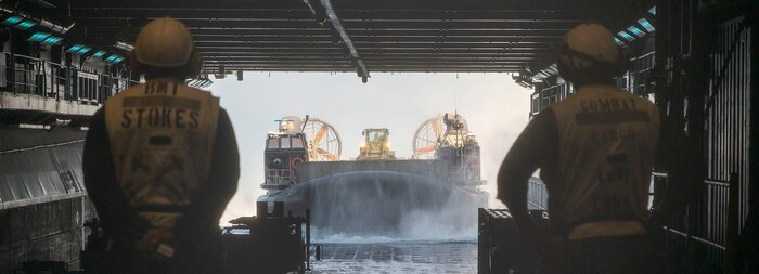 U.S. Navy Landing Craft, Air Cushion 76, attached to Assault Craft Unit 5, enters the well deck of the amphibious assault ship USS Boxer (LHD 4) transporting 15th Marine Expeditionary Unit personnel and equipment in the Pacific Ocean July 5, 2024.