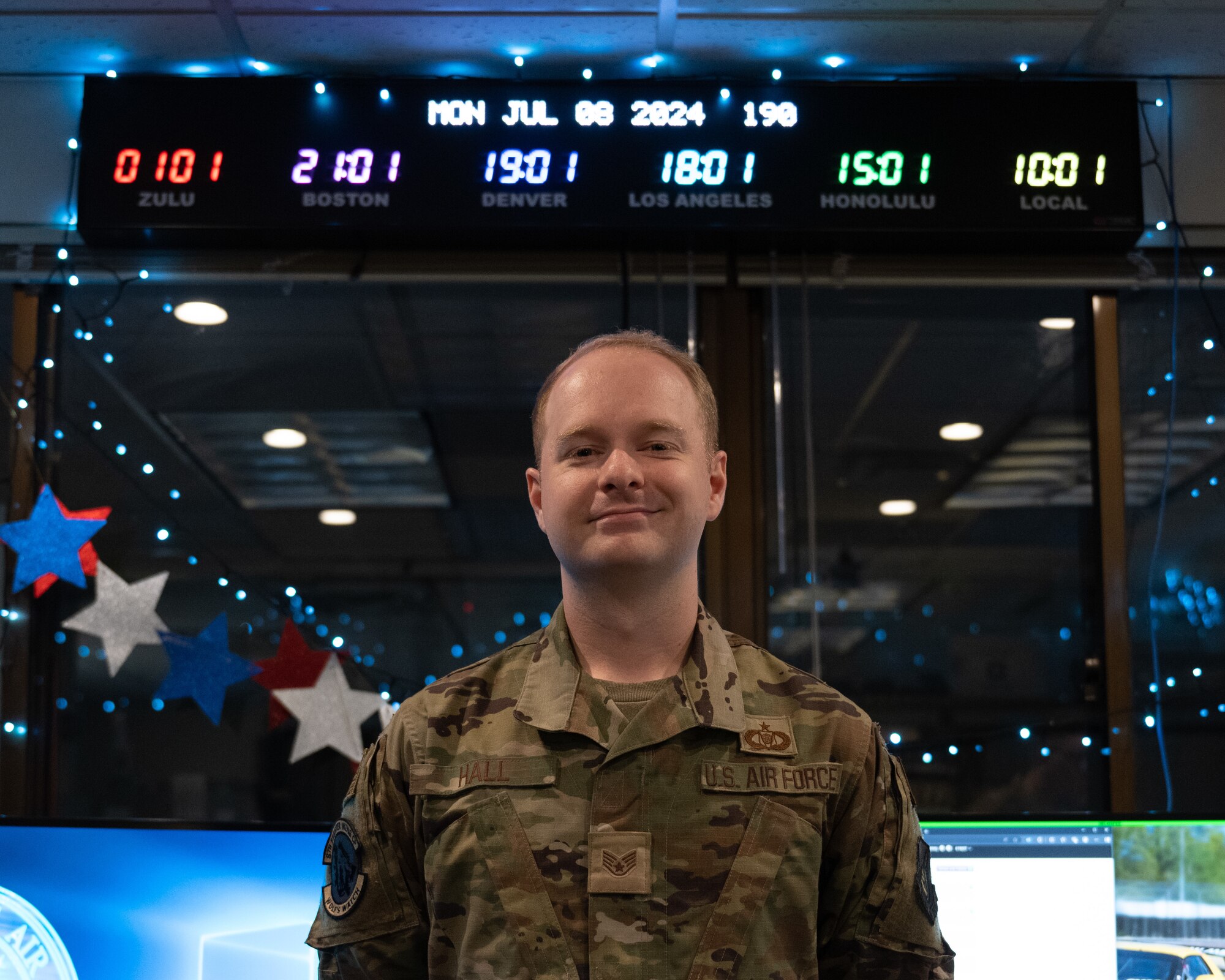 U.S. Air Force Staff Sgt. Hunter Hall, 8th Fighter Wing emergency actions controller, stands for a photo.