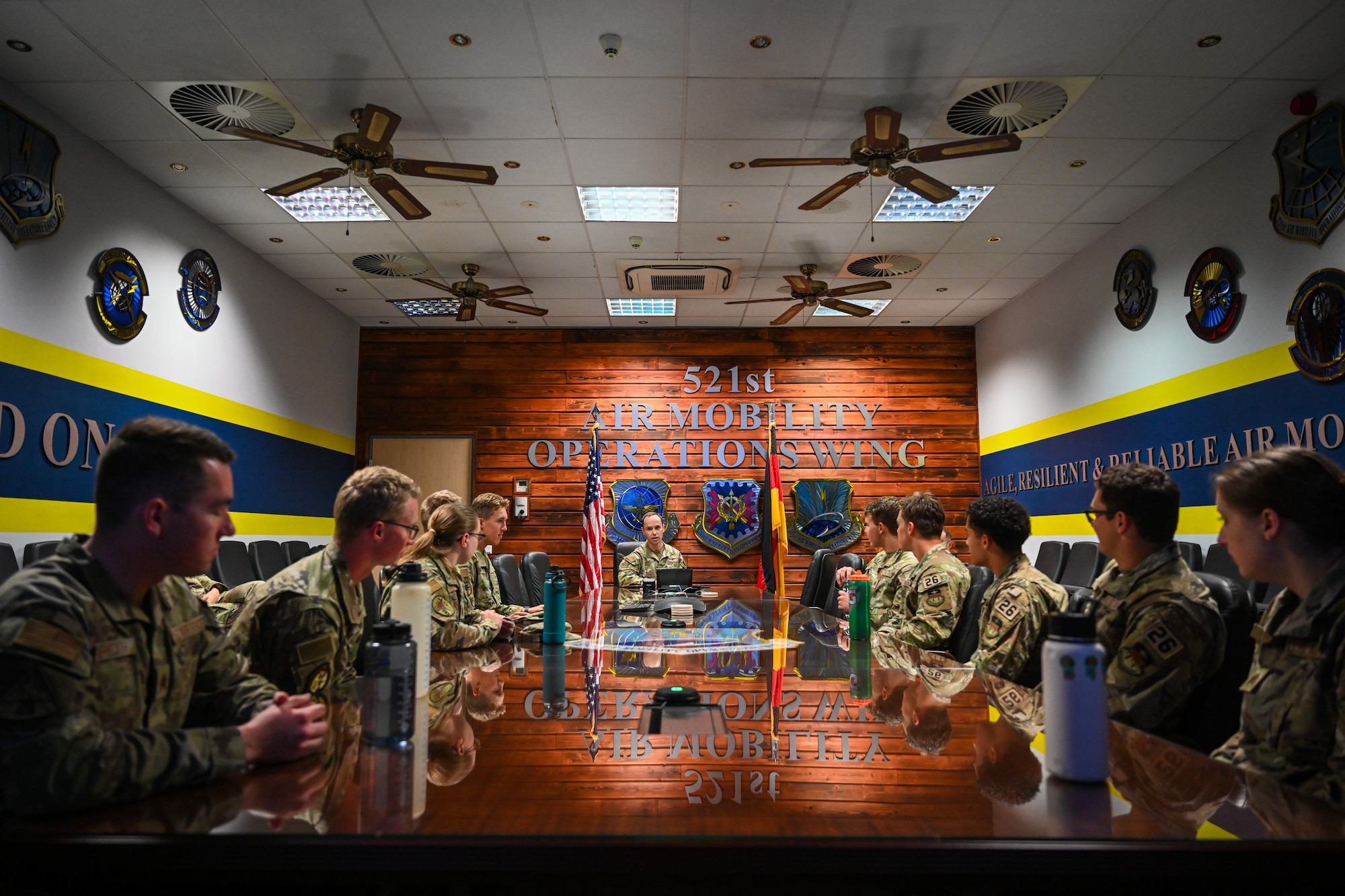 Col. Michael Garrott, center, 521st Air Mobility Operations Wing deputy commander, gives a mission brief to United States Air Force Academy cadets at the 521 AMOW headquarters building July 8, 2024, on Ramstein Air Base, Germany.