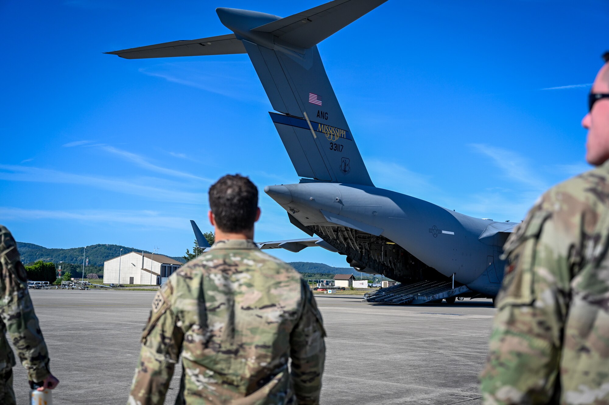 United States Air Force Academy cadets walk towards a C-17 Globemaster III on the flightline at Ramstein Air Base, Germany, July 8, 2024.