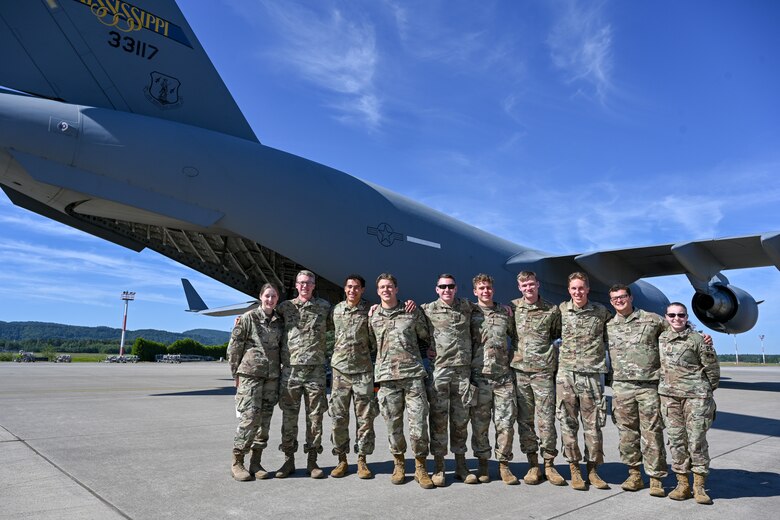 United States Air Force Academy cadets pose for a photo in front of a C-17 Globemaster III on the flightline at Ramstein Air Base, Germany, July 8, 2024.