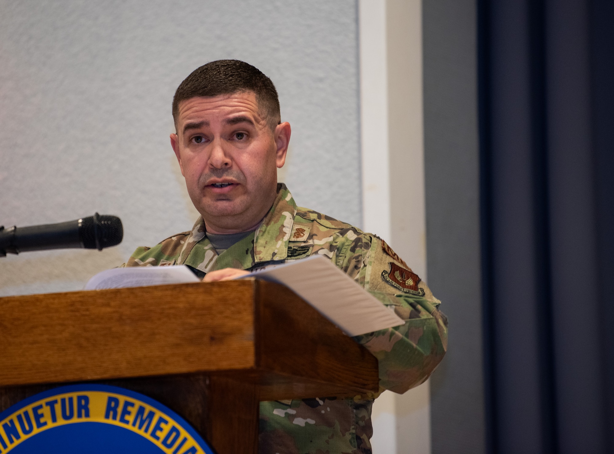Colonel speaks to audience.