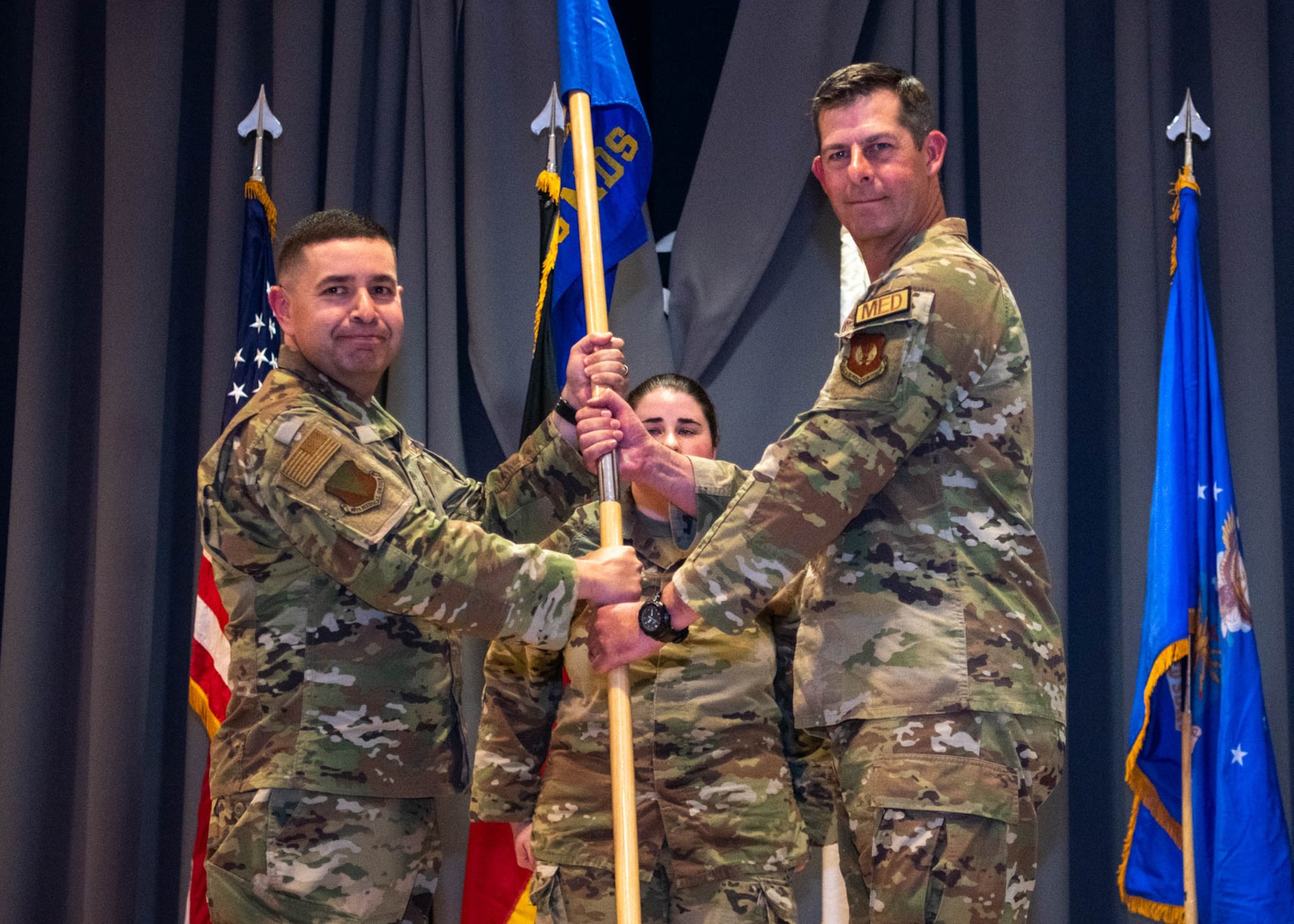 Group commander passes guidon to new squadron commander.