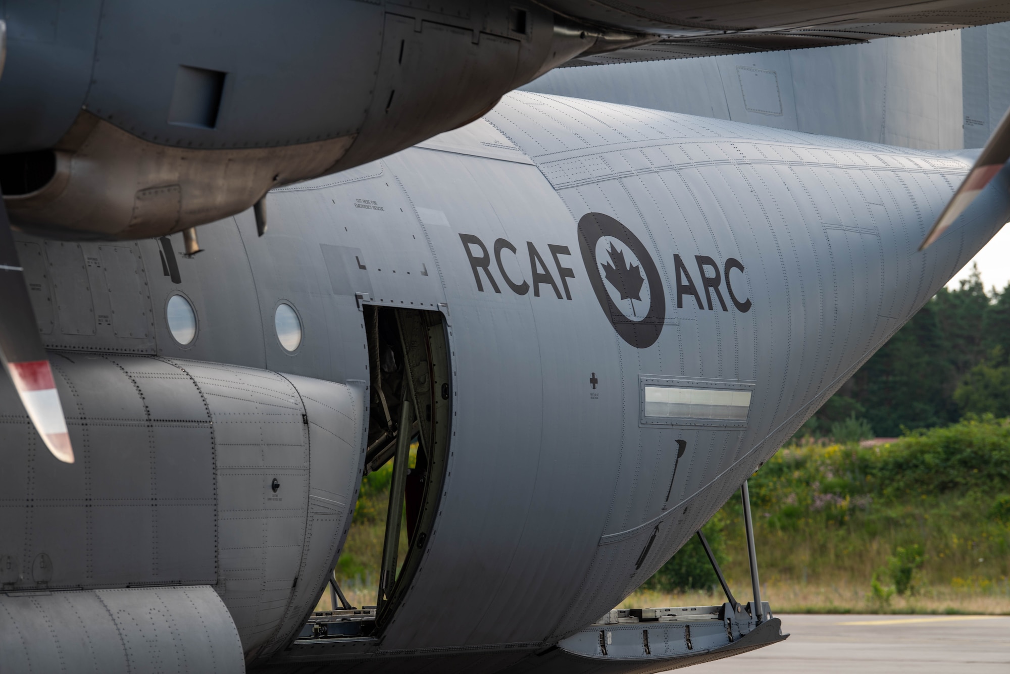 Aircraft sits on airfield.