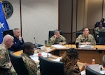 Air Force Gen. Timothy D. Haugh, commander of U.S. Cyber Command, Director of National Security Agency, and Chief of the Central Security Service, receives an outbrief during the Global Logistics Cyber Resiliency Summit. Senior leaders and staff from over 35 commands converged on Fort Meade June 11 and 12 to participate in the summit hosted by U.S. Transportation Command, U.S. Cyber Command and Joint Force Headquarters-Department of Defense Information Network. (Department of Defense photo by MCC(SW/AW) Thomas Miller/Released)