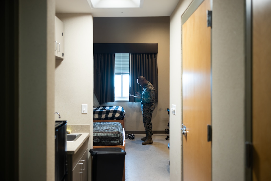 U.S. Marine Corps Gunnery Sgt. Michael Adams with 8th Communications Battalion, II Marine Expeditionary Force Information Group, II MEF, inspects a barracks room during a service-wide environmental, health and safety inspection on Marine Corps Base Camp Lejeune, North Carolina, Feb. 27, 2024. The service is committed to understanding the condition of all barracks units to best implement Barracks 2030 actions and improve Marines’ quality of life. (U.S. Marine Corps photo by Sgt. Josue Marquez)