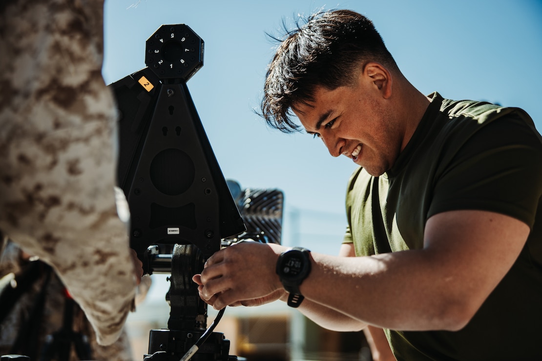 U.S. Marine Corps Lance Cpl. Patricio Ortiz, an Augusta, Michigan native, satellite transmissions system operator with 8th Communication Battalion, II Marine Expeditionary Force Information Group, II MEF, sets up a portable Very Small Aperture Terminal during an Expeditionary Communications Course hosted by Marine Corps Communication-Electronics School at Marine Corps Air-Ground Combat Center, Twentynine Palms, California, April 2, 2024. ECC trains Marines in expeditionary skillsets that enable them to operate in any environment across the full range of military operations. (U.S. Marine Corps photo by Lance Cpl. Richard PerezGarcia)