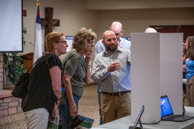 Joseph Maxwell (right), operations project manager with the U.S. Army Corps of Engineers, Omaha District, informs members of the public about upcoming plans for a gate maintenance project at Bear Creek Dam in Littleton, Colorado, on June 25, 2024.