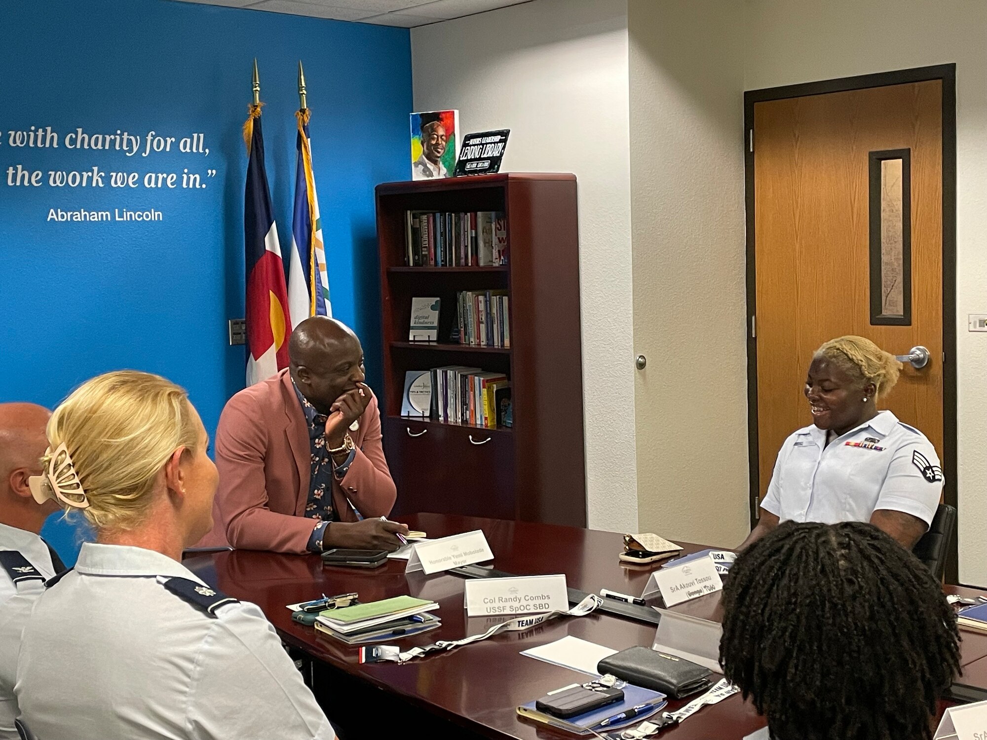 A group of 10 Airmen from Peterson and Schriever Space Force Base met with Colorado Springs Mayor Yemi Mobolade July 8, 2024, at his office downtown. The Airmen shared stories of their backgrounds, and why they chose to become U.S. citizens and serve their country. Mobolade, who himself immigrated from Nigeria in 1996, became the first elected Black and immigrant mayor of Colorado Springs in 2023. (Courtesy photo)