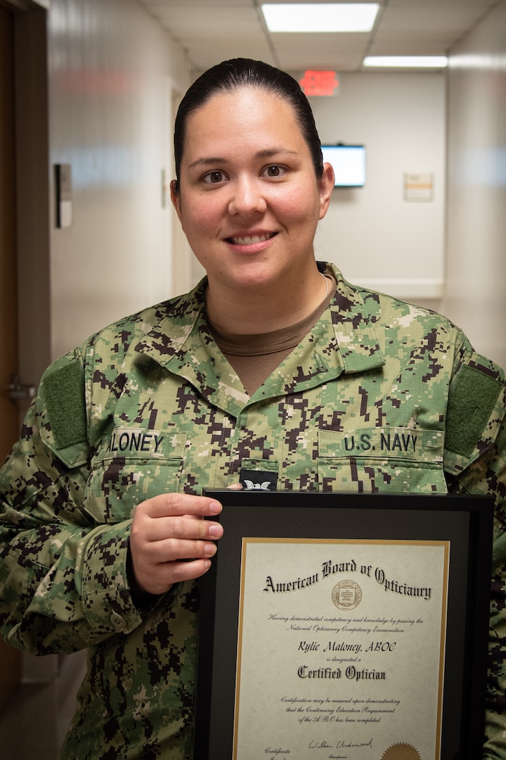 Hospital Corpsman Second Class Rylie Maloney is the first military applicant to receive an Optician’s License from the state of North Carolina after passing the American Board of Opticianry exam in early summer, 2024.  
Maloney, a native of Soddy Daisy, Texas, serves aboard Naval Health Clinic Cherry Point as the Optometry Leading Petty Officer, responsible for the day-to-day operations of the facility’s Optometry Clinic serving Active-Duty Marines and Sailors assigned to the base, their families and beneficiaries in the surrounding communities.