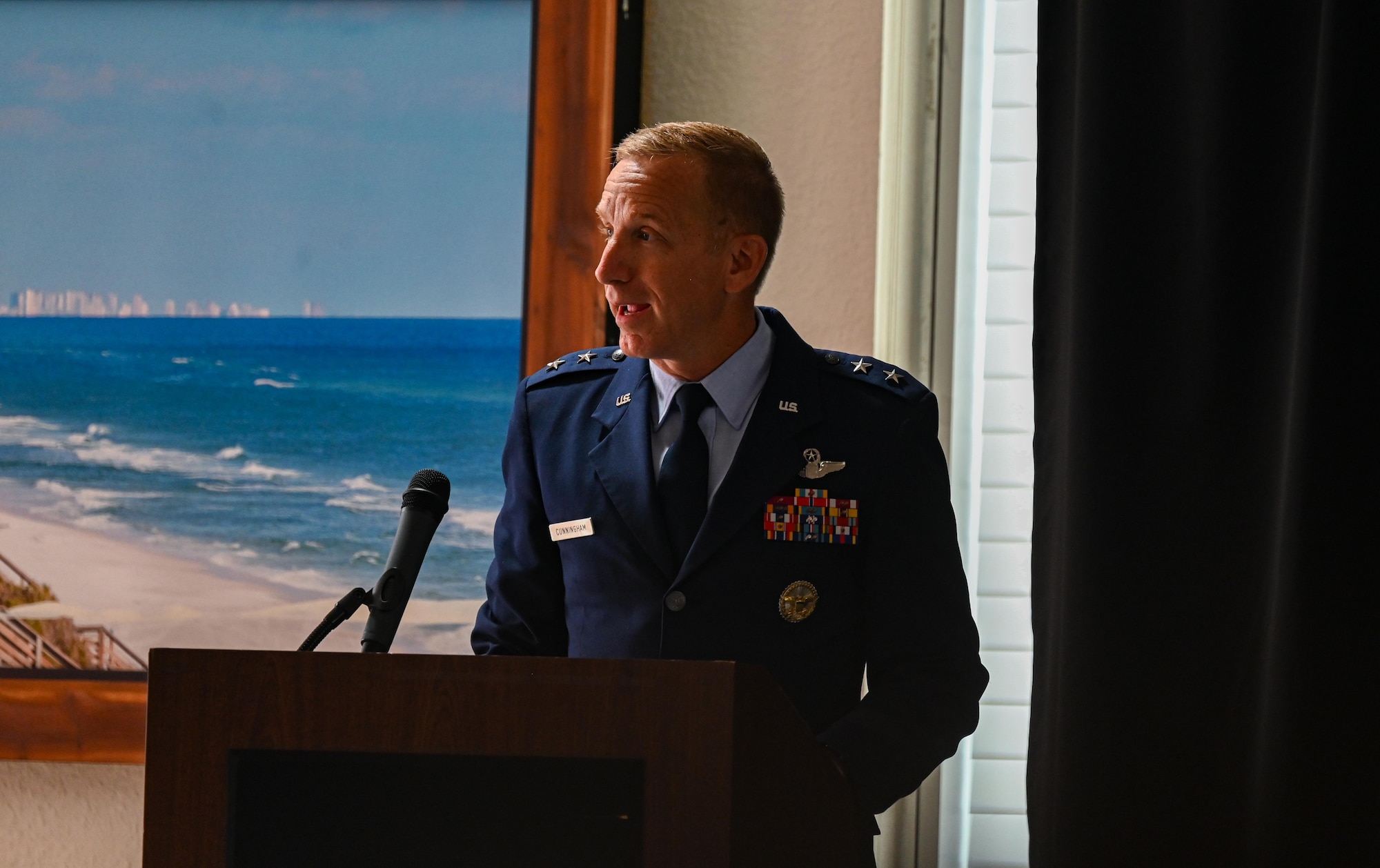 U.S. Air Force Maj. Gen. Case Cunningham, U.S. Air Force Warfare Center commander, gives remarks at the 350th Spectrum Warfare Wing change of command ceremony at Eglin Air Force Base, July 9, 2024. The ceremony was the third change of command for the wing since it activated in 2021 to modernize and consolidate the Air Force’s electromagnetic warfare capabilities (U.S. Air Force photo by Capt. Benjamin Aronson)