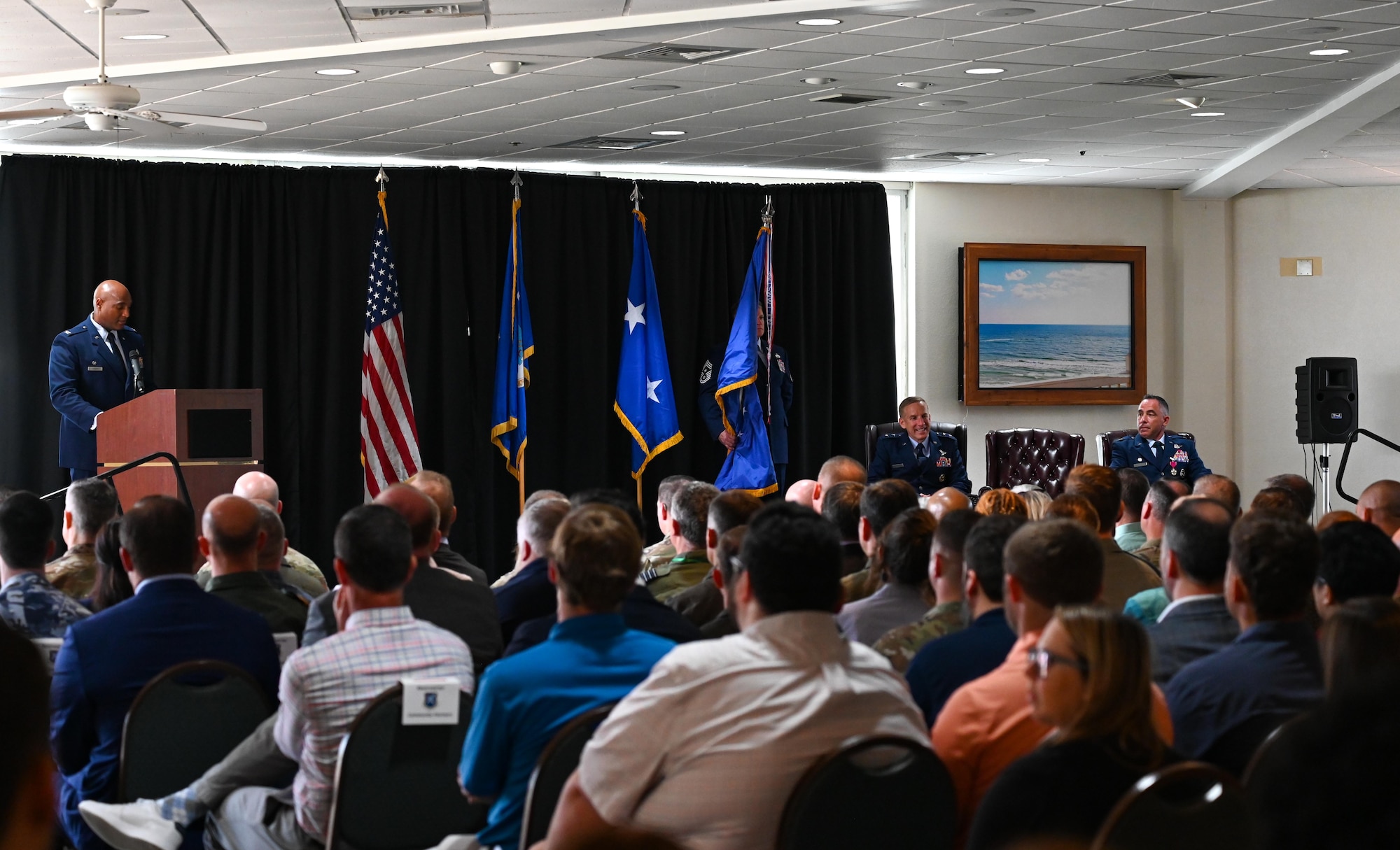 U.S. Air Force Col. Larry Fenner Jr., 350th Spectrum Warfare Wing commander, far left, gives his first remarks to the wing after taking command at Eglin Air Force Base, Florida, July 9, 2024. Fenner is the wing’s third commander and previously served as the deputy wing commander for the 36th Wing at Anderson AFB, Guam. (U.S. Air Force photo by Capt. Benjamin Aronson)