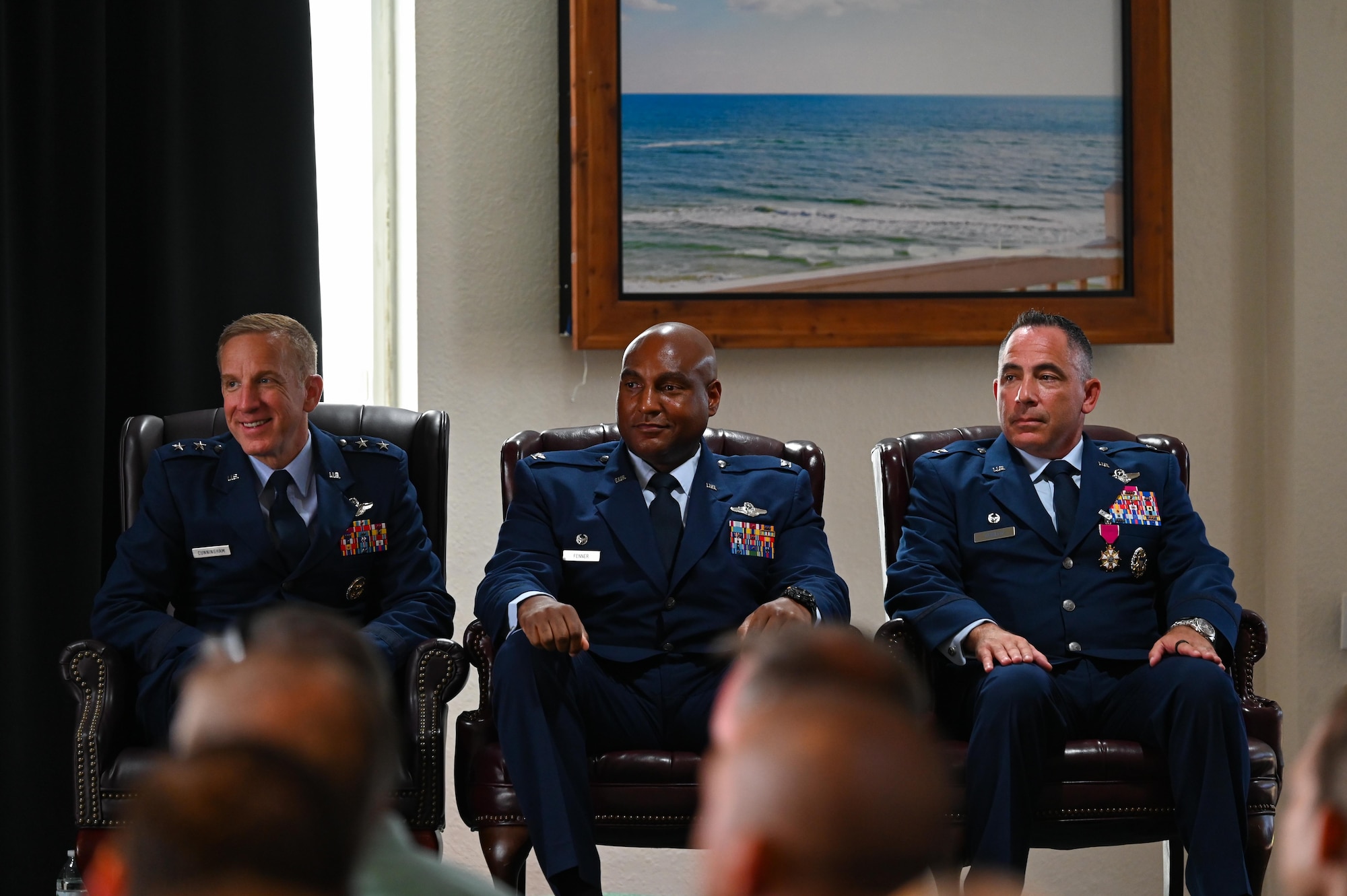 U.S. Air Force Maj. Gen. Case Cunningham, U.S. Air Force Warfare Center commander, left, U.S. Air Force Col. Larry Fenner Jr., 350th Spectrum Warfare Wing commander, U.S. Air Force Col. Josh Koslov, former 350th SWW commander, attend the wing’s third change of command at Eglin Air Force Base, Florida, July 9, 2024. Fenner is an electronic warfare officer with service in the B-52 and served the United States Indo-Pacific Command as Command Electronic Warfare Officer and Air Force Global Strike Command as Chief of Bomber Requirements. (U.S. Air Force photo by Capt. Benjamin Aronson)