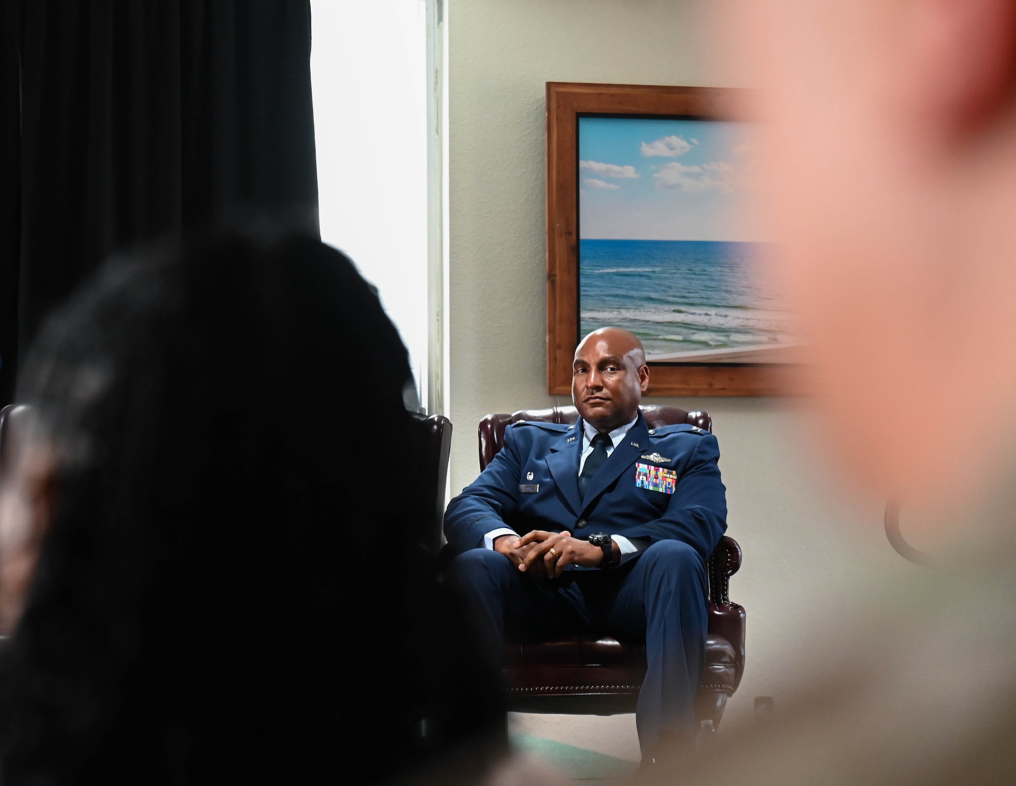 U.S. Air Force Col. Larry Fenner Jr., 350th Spectrum Warfare Wing incoming commander, sits during the change of command ceremony at Eglin Air Force Base, Florida, July 9, 2024. Fenner took command in the wing’s third change of command ceremony since its activation in 2021, and will lead 15 units across four installations. (U.S. Air Force photo by Senior Airman Anna Smith)