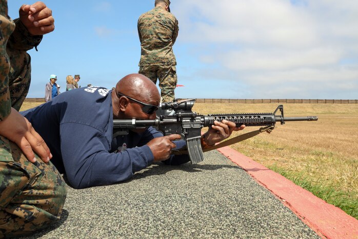 Ruben Robinson, a Houston, Texas-area educator, fires an M16A4 service rifle during Educator's Workshop at Marine Corps Base Camp Pendleton, Calif., May 29, 2023. Educator's Workshop is a four-day program, held annually, designed to inform high school and college educators about the commitment and benefits of service in the U.S. Marine Corps. Attendees then return to their place of business with the ability to provide firsthand experience and knowledge to individuals interested in military service. (U.S. Marine Corps photo by Sgt. Ryan H. Pulliam)