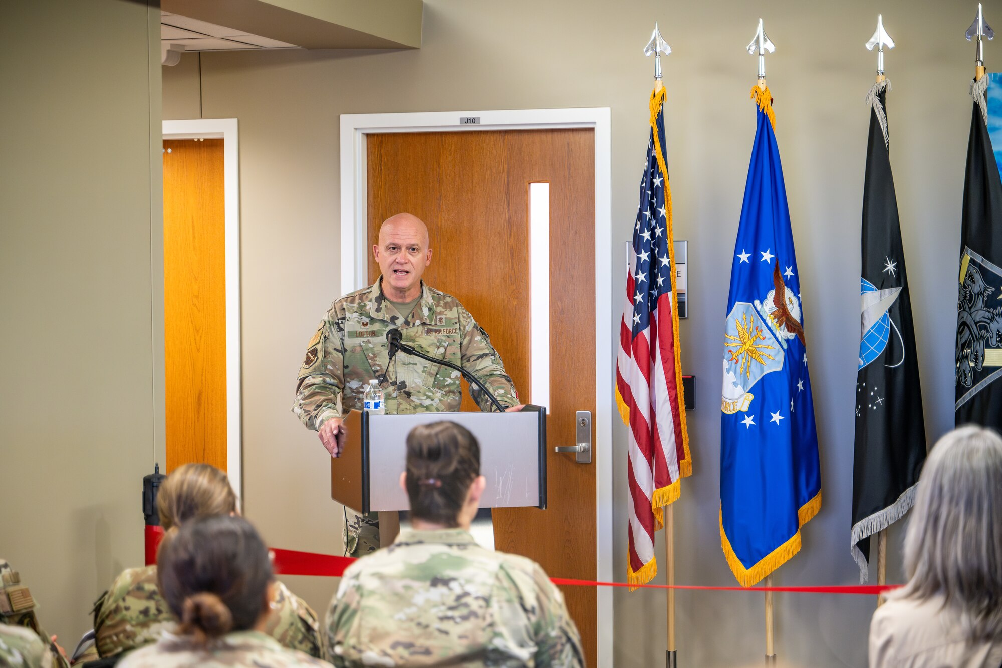 U.S. Air Force Col. Donald Lofton, 21st Medical Group commander, gives remarks during an opening ceremony of the new medical clinic on Schriever Space Force Base, Colorado, July 1, 2024. Military bases must have medical facilities to ensure the health and well-being of their personnel and families. With a growing base, these improvements are geared toward increasing operational readiness and overall quality of life for the community at Schriever SFB. (U.S. Space Force Photo by Dalton Prejeant)