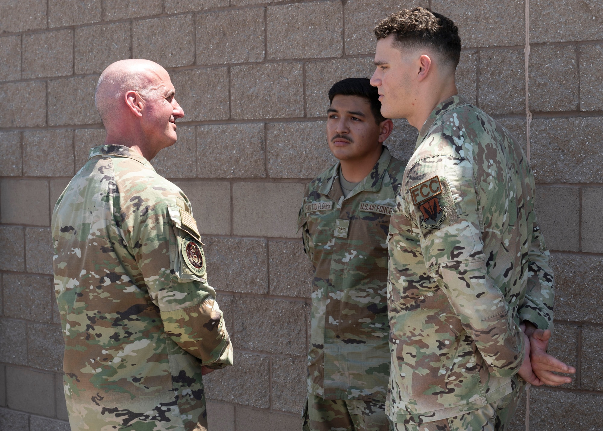 Chief Master Sergeant of the Air Force David Flosi talks with 355th Wing Airmen before departure at Davis-Monthan Air Force Base, Ariz., July 9, 2024. Flosi visited the installation to get a firsthand look at how Airmen support their unit’s mission and thanked them for their hard work and commitment. (U.S. Air Force photo by Airman 1st Class William Finn V)