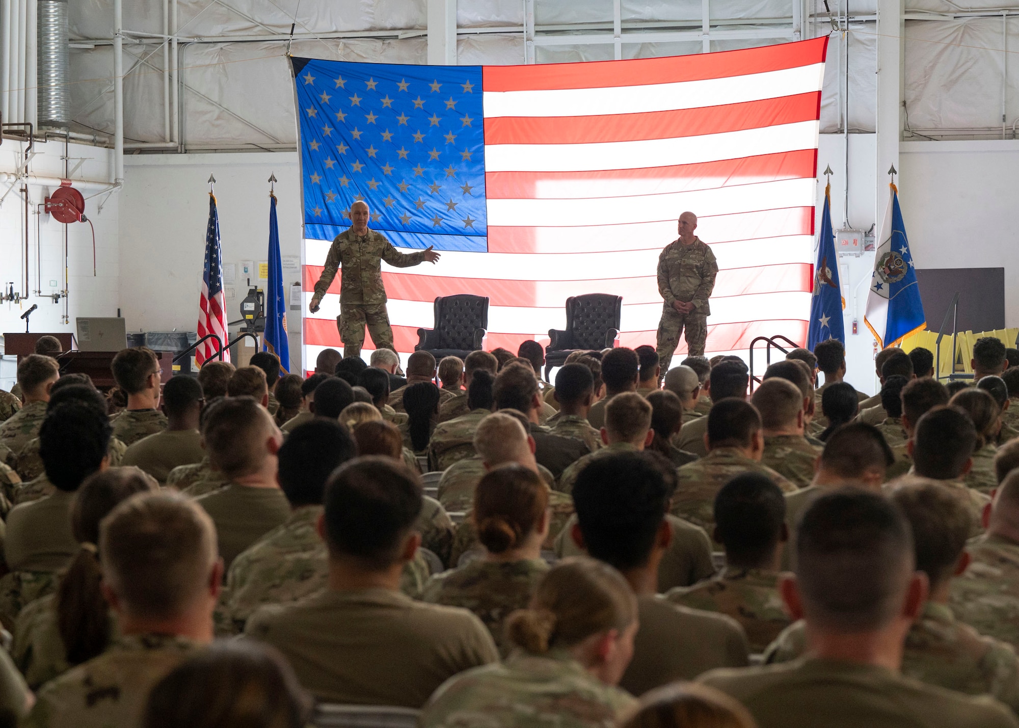 Air Force Chief of Staff Gen. David Allvin and Chief Master Sergeant of the Air Force David Flosi speak
with Airmen during an all-call at Davis-Monthan Air Force Base, Ariz., July 9, 2024. Allvin and Flosi spoke to Airmen about the future of Davis-Monthan, answered their questions and thanked them for their dedication to the mission. (U.S. Air Force photo by Airman 1st Class William Finn V)