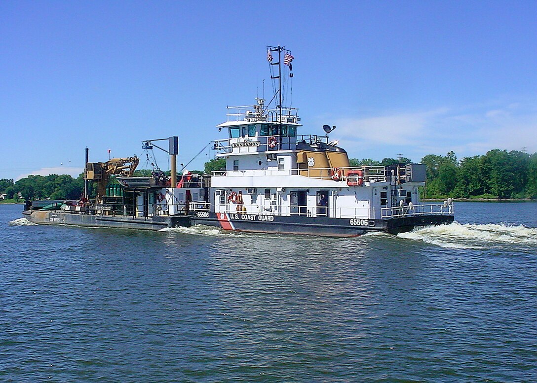 US Coast Guard Sangamon buoy tender heads upstream on the Mississippi river above St. Louis on August 8, 2005.