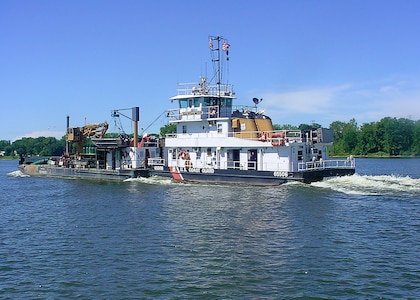 US Coast Guard Sangamon buoy tender heads upstream on the Mississippi river above St. Louis on August 8, 2005.