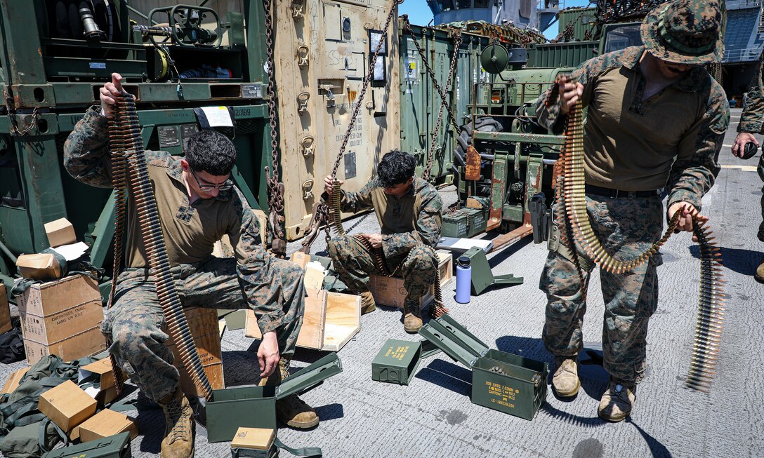 U.S. Marines with Combat Logistics Battalion 24, 24th Marine Expeditionary Unit (MEU) Special Operations Capable (SOC), prepare ammunition for a crew served weapons range aboard the Harpers Ferry-class dock landing ship USS Oak Hill (LSD 51), while underway in the Mediterranean Sea, June 22, 2024. The Wasp Amphibious Readiness Group-24th MEU (SOC) is conducting operations in U.S. Naval Forces Europe area of operations to support high-end warfighting exercises while demonstrating speed and agility in a dynamic security environment. (U.S. Marine Corps photo by Sgt. Jacqueline Peguero-Montes)