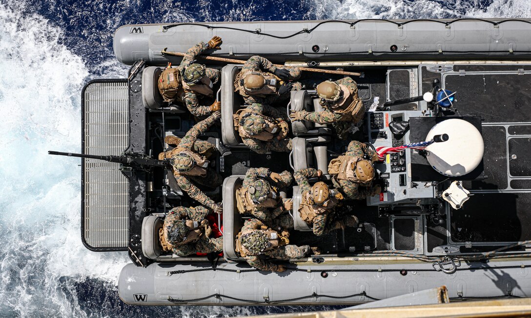 U.S. Marines with Battalion Landing Team 1/8, 24th Marine Expeditionary Unit (MEU) Special Operations Capable (SOC), embark on to a rigid-hull inflatable boat with the Harpers Ferry-class dock landing ship USS Oak Hill (LSD 51) during small boat operations, while underway in the Mediterranean Sea, June 24, 2024. The Wasp Amphibious Ready Group-24th MEU (SOC) is conducting operations in U.S. Naval Forces Europe area of operations to support high-end warfighting exercises while demonstrating speed and agility in a dynamic security environment. (U.S. Marine Corps photo by Sgt. Jacqueline Peguero-Montes)