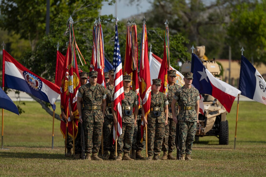 U.S. Marines with Marine Air Control Group (MACG) 28 color guard stand at attention during change of command ceremony at Marine Corps Air Station Cherry Point, North Carolina, June 27, 2024. The ceremony represented a transfer of responsibility, authority, and accountability from Col. Brian McLean to Col. Kurt Gall. (U.S. Marine Corps photo by Lance Cpl. Bryan Giraldo)